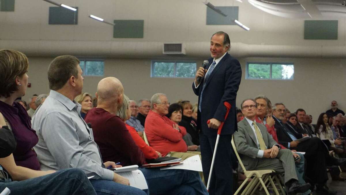 Gabriel Haddad, CEO of Romerica, The Herons Kingwood Marina's developer, addresses the audience at the community meeting on March 18, 2019 in Kingwood, TX.