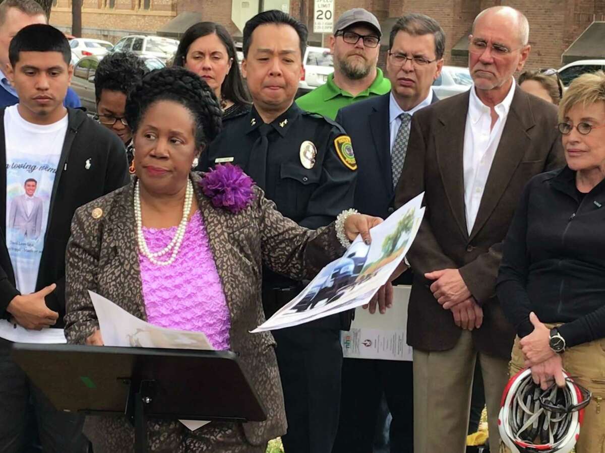 Rep. Sheila Jackson Lee, D-Houston, stands with the family of David Loya and local officials as she discusses the need for federal legislation to improve bicycle safety on streets on March 19. Loya, 23, was killed March 7 while riding along Heights Boulevard.