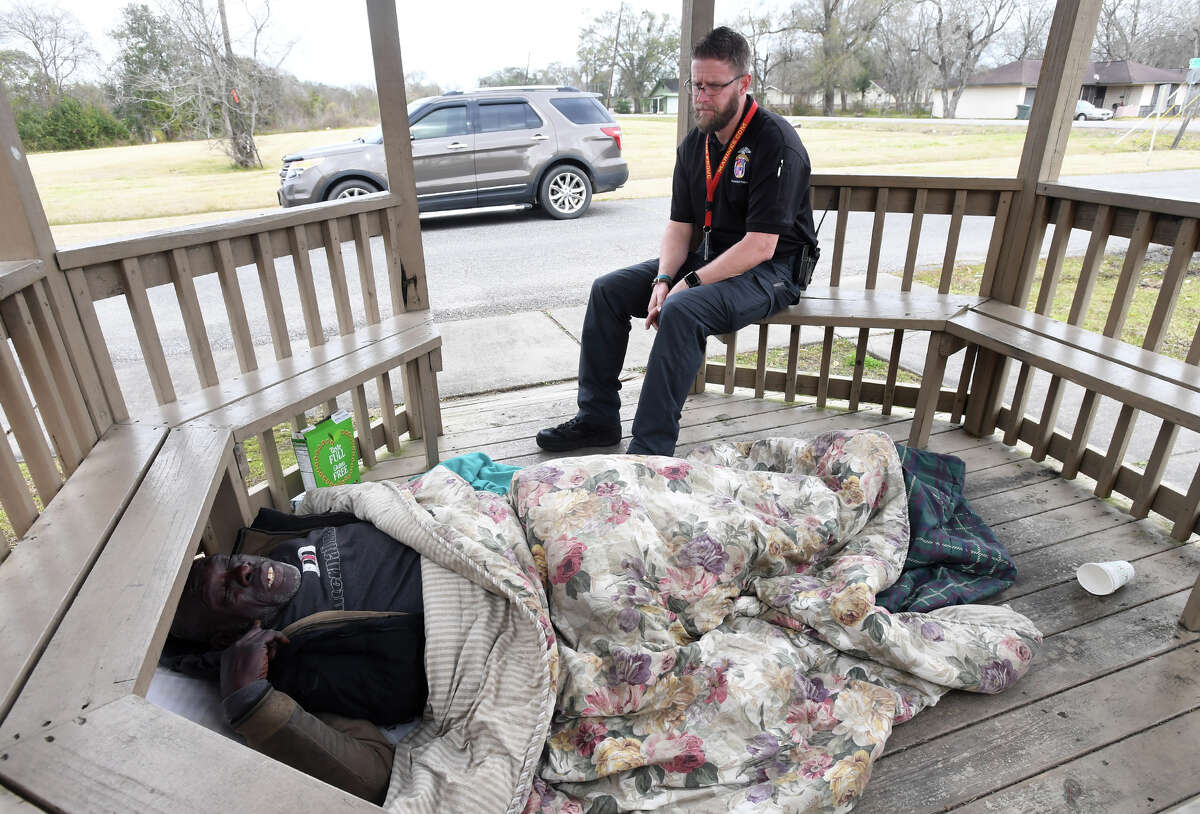 Beaumont Police's Jeffrey Manzer, talks Thursday to Kevin Bell a homeless man taking temporary shelter in a gazebo to keep warm. Manzer, the department's first mental illness officer, patrols areas where people with mental illness are commonly found, works with other officers dealing with the mental ill and responds to crisis situations. Photo taken Thursday, 1/31/19