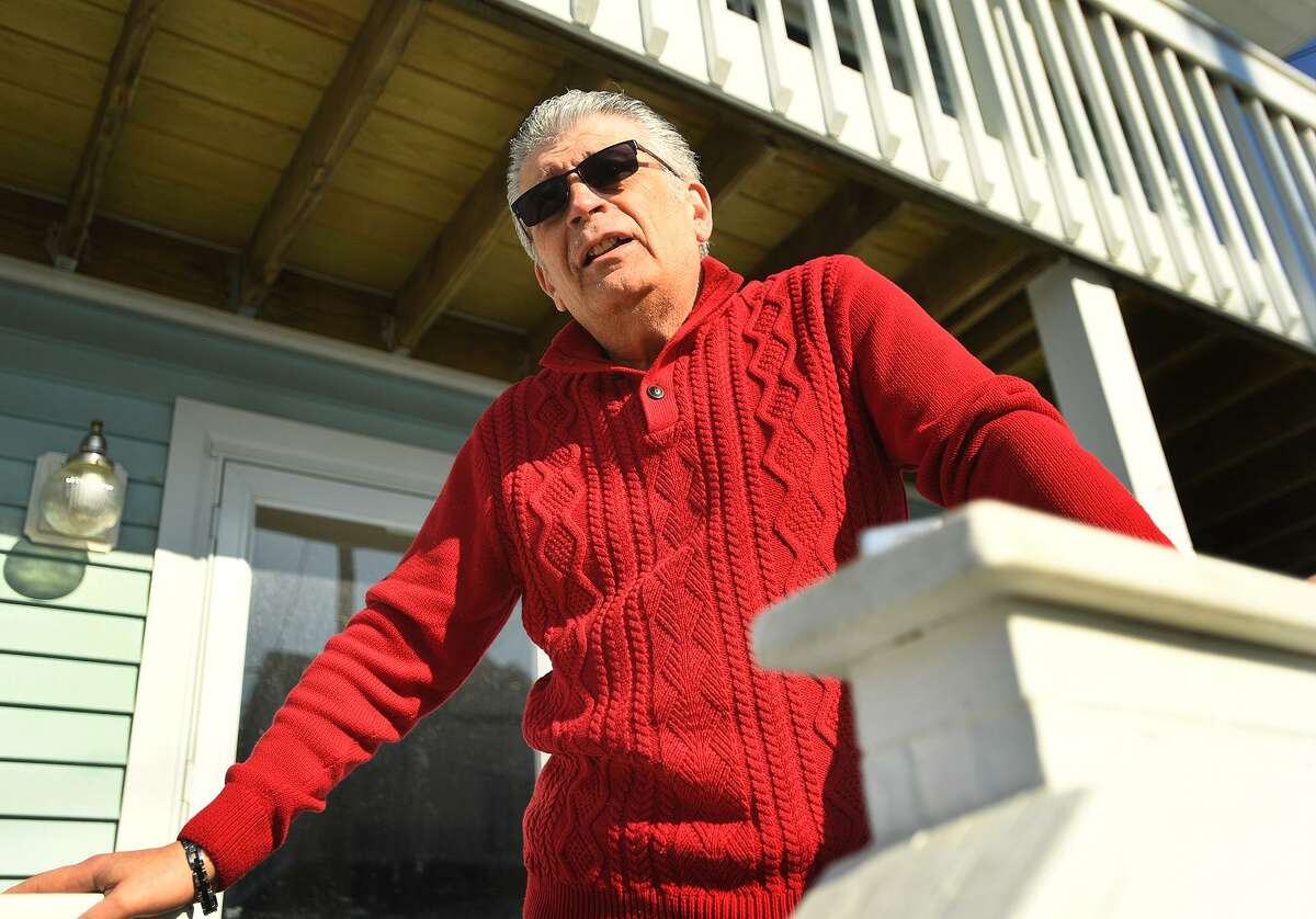 East Broadway resident Ray Meglio discusses the fire that destroyed the new pavilion, concessions, and bathrooms at Silver Sands State Park in Milford, Conn. on Wednesday, March 20, 2019. The fire started late Tuesday night and was fully involved when firefighters arrived on scene. Meglio said he had feared that embers from the fire might ignites nearby homes.