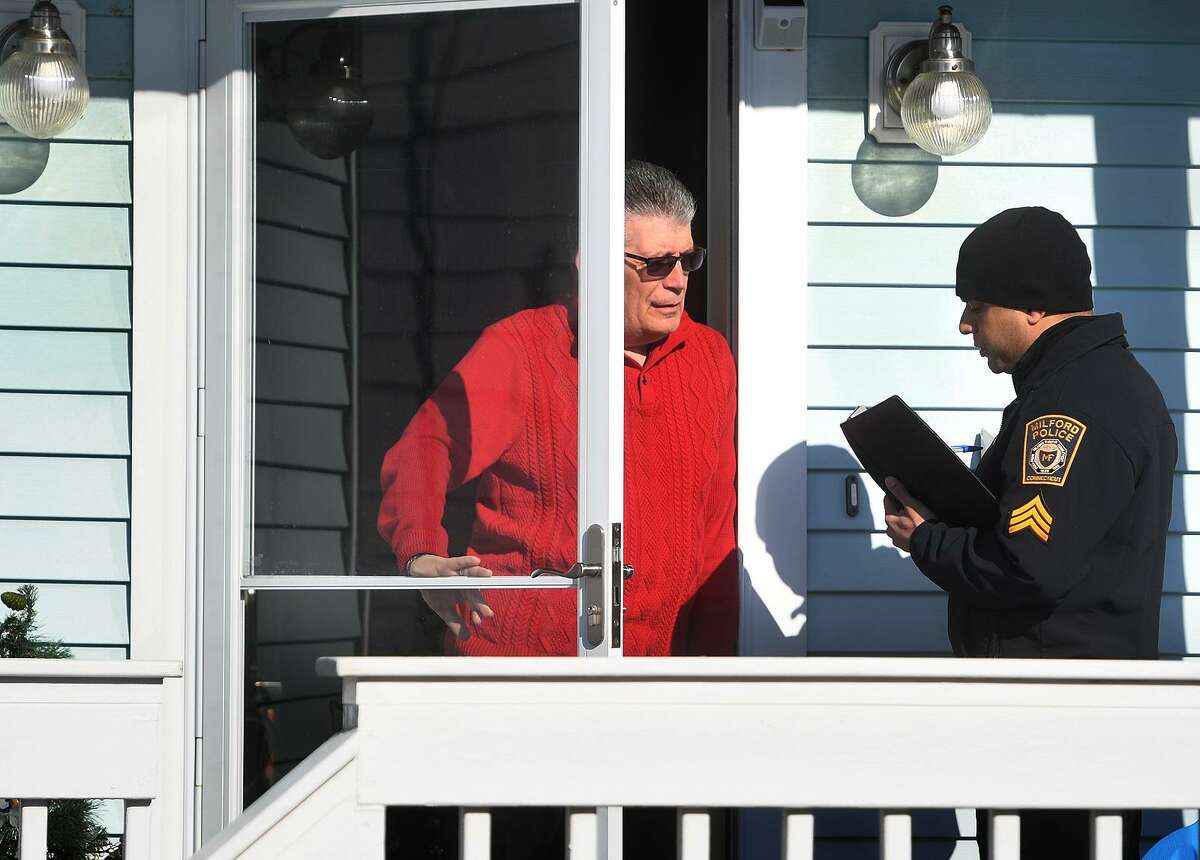 East Broadway resident Ray Meglio is interviewed as police go door to door following the fire that destroyed the new pavilion, concessions, and bathrooms at Silver Sands State Park in Milford, Conn. on Wednesday, March 20, 2019. Meglio said he had feared that embers from the fire might ignites nearby homes.