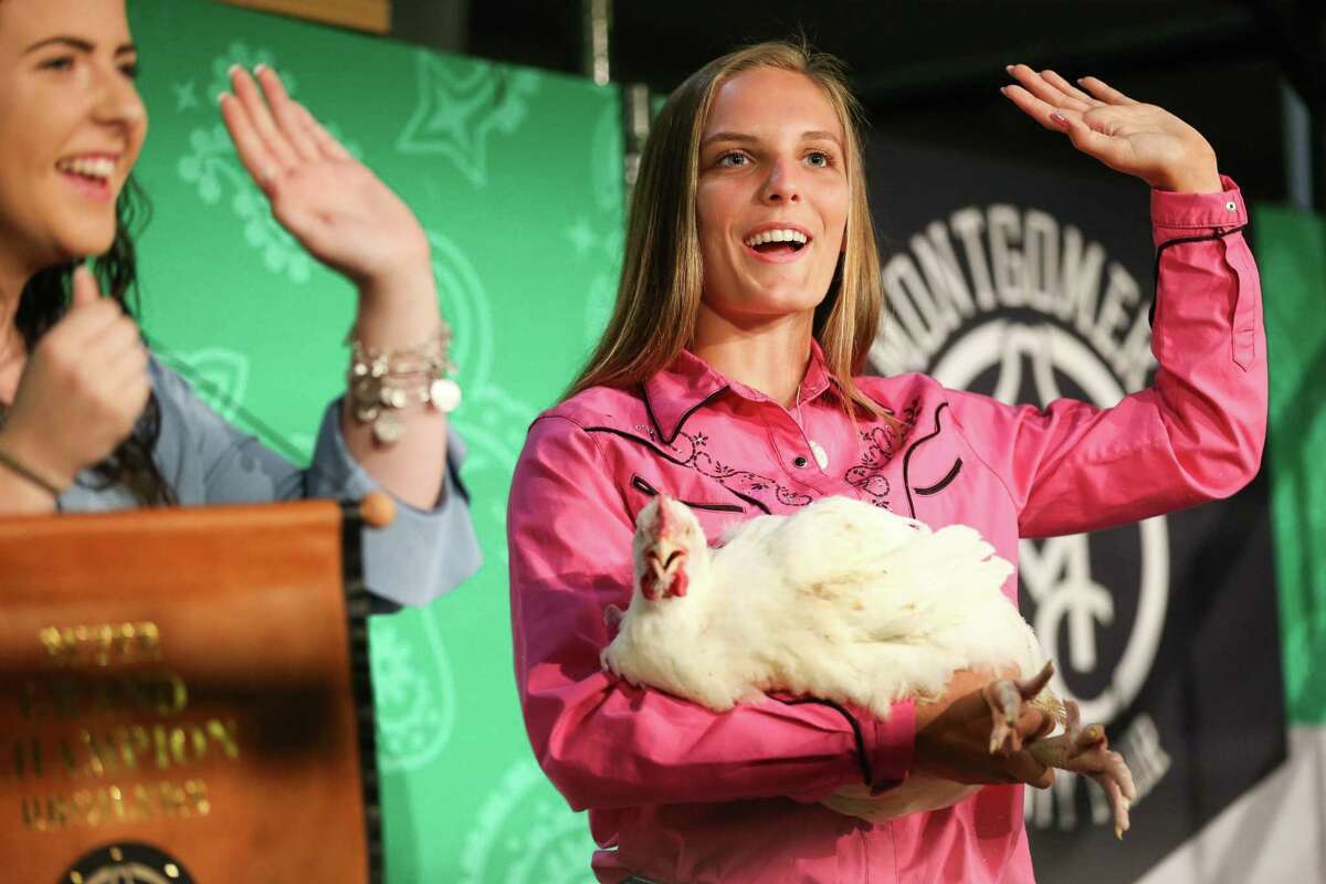Champion 4-H's Kinley Butz shows her grand champion broiler chicken during the Montgomery County Fair Junior Livestock Auction on Wednesday, April 18, 2018, at the Lone Star Convention Center.