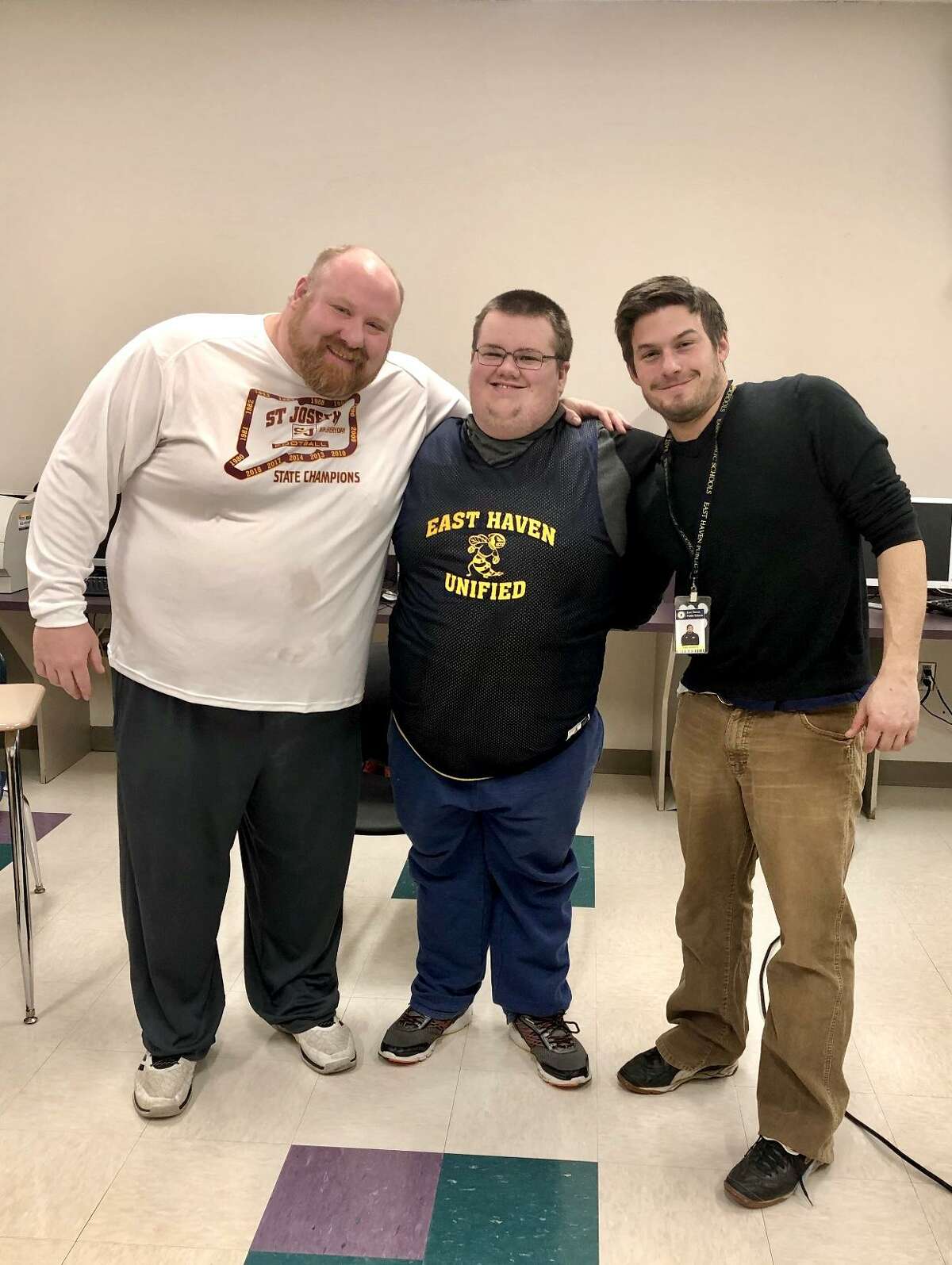 EHHS Unified Sports co-head coach Chris Bugyi, EHHS SCC Scholar-Athlete Kevin Pettis, and EHHS Unified Sports co-head coach Jake Hackett