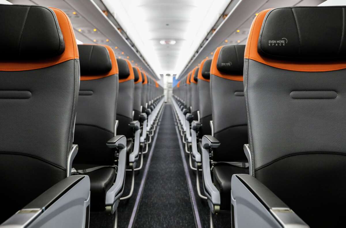 JetBlue is updating its Airbus A320 fleet with new black, gray and orange accented seats and better technology.
