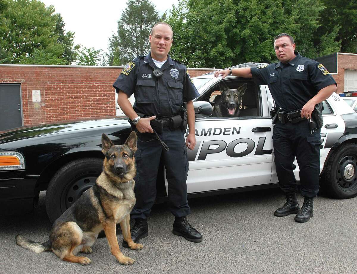 Hamden K-9 Police Officers Craig Appleby, left, with “Hunter” and Bryan Kelly with “Brix” in this file photo.