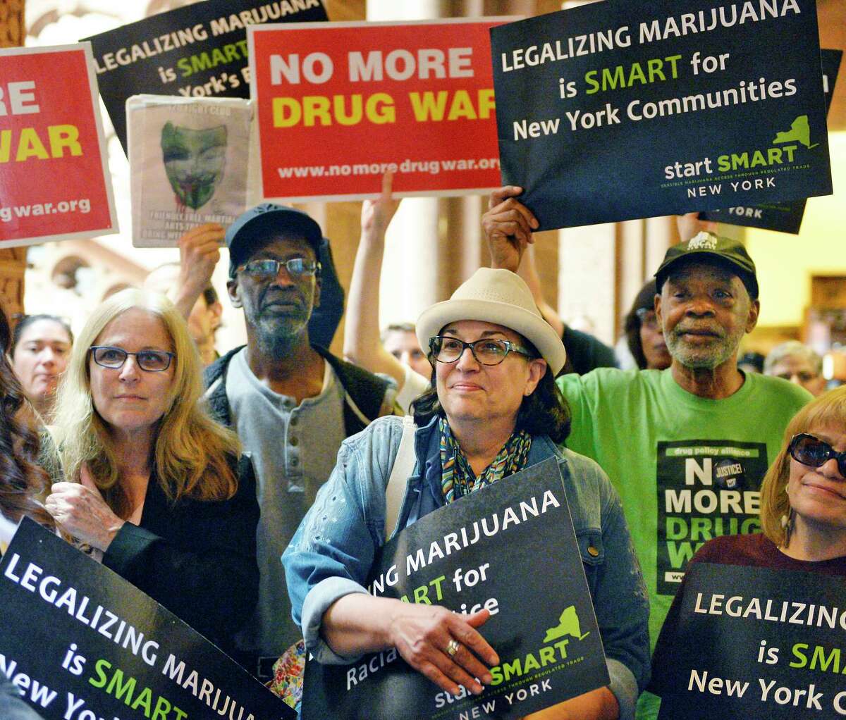 Advocates rally outside the Senate Chambers to demand marijuana legalization in New York at the Capitol Tuesday May 8, 2018 in Albany, NY. (John Carl D'Annibale/Times Union)