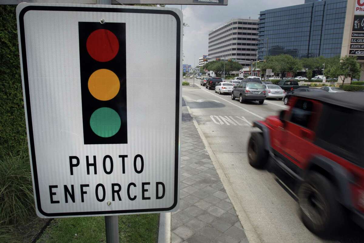 Houston removed its red-light cameras, including this one seen in July 2011 at Loop 610 and Westheimer, after voters rejected their use.
