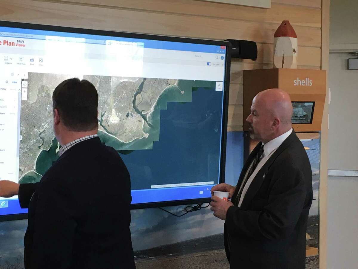 State Rep. Joe Gresko, D-Stratford, explores his district on a map created as part of the Blue Plan, which aims to protect Long Island Sound by creating an inventory of its resources and uses, March 20 in Madison.
