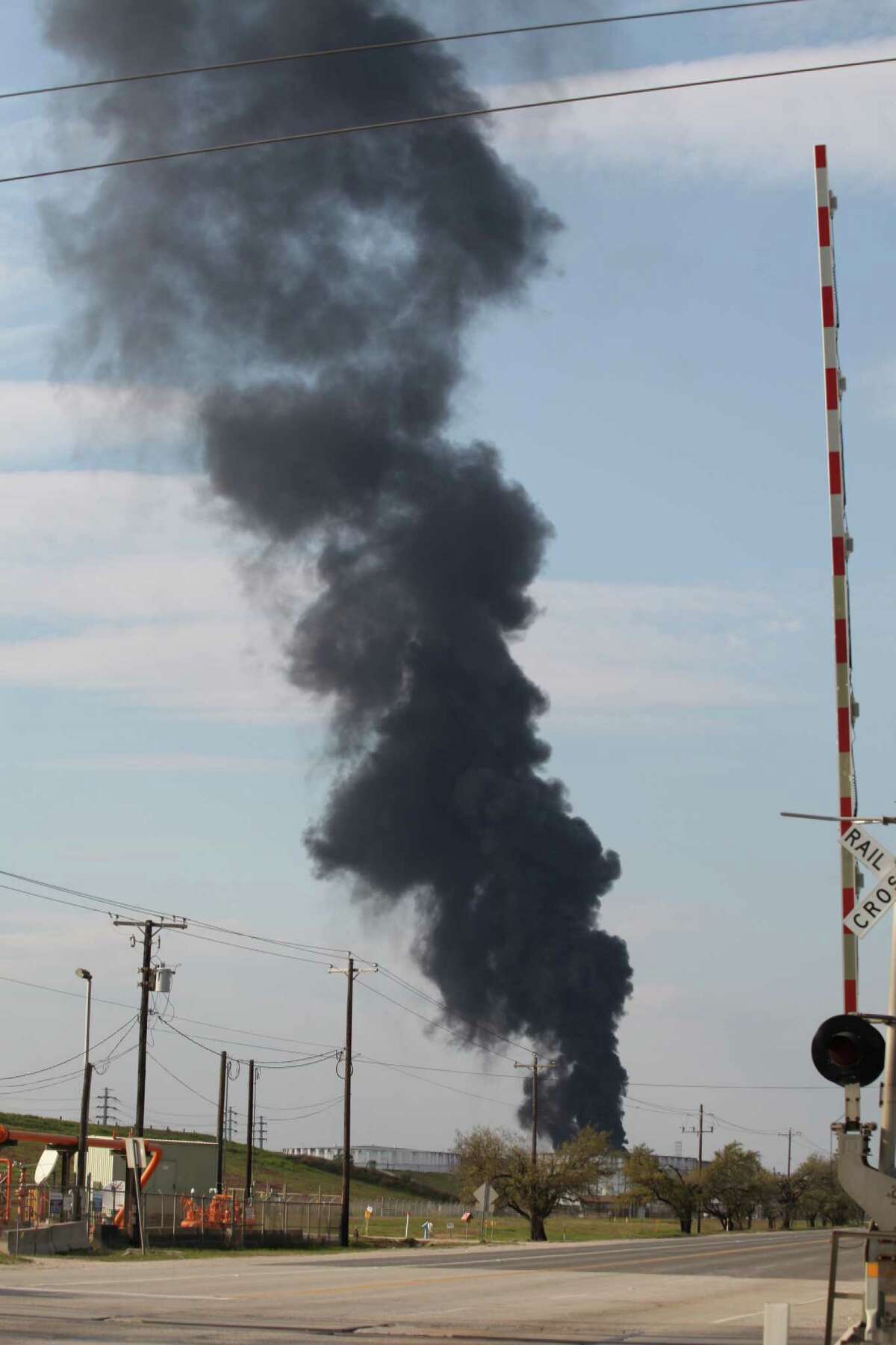 A plume of black smoke rises from the ITC industrial site on March 20, 2019, after an apparent flare-up.