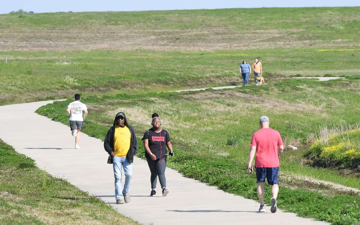 Health enthusiasts walk the Folsom Hike and Bike Trail in Beaumont on Tuesday. Photo taken Tuesday, 3/19/19