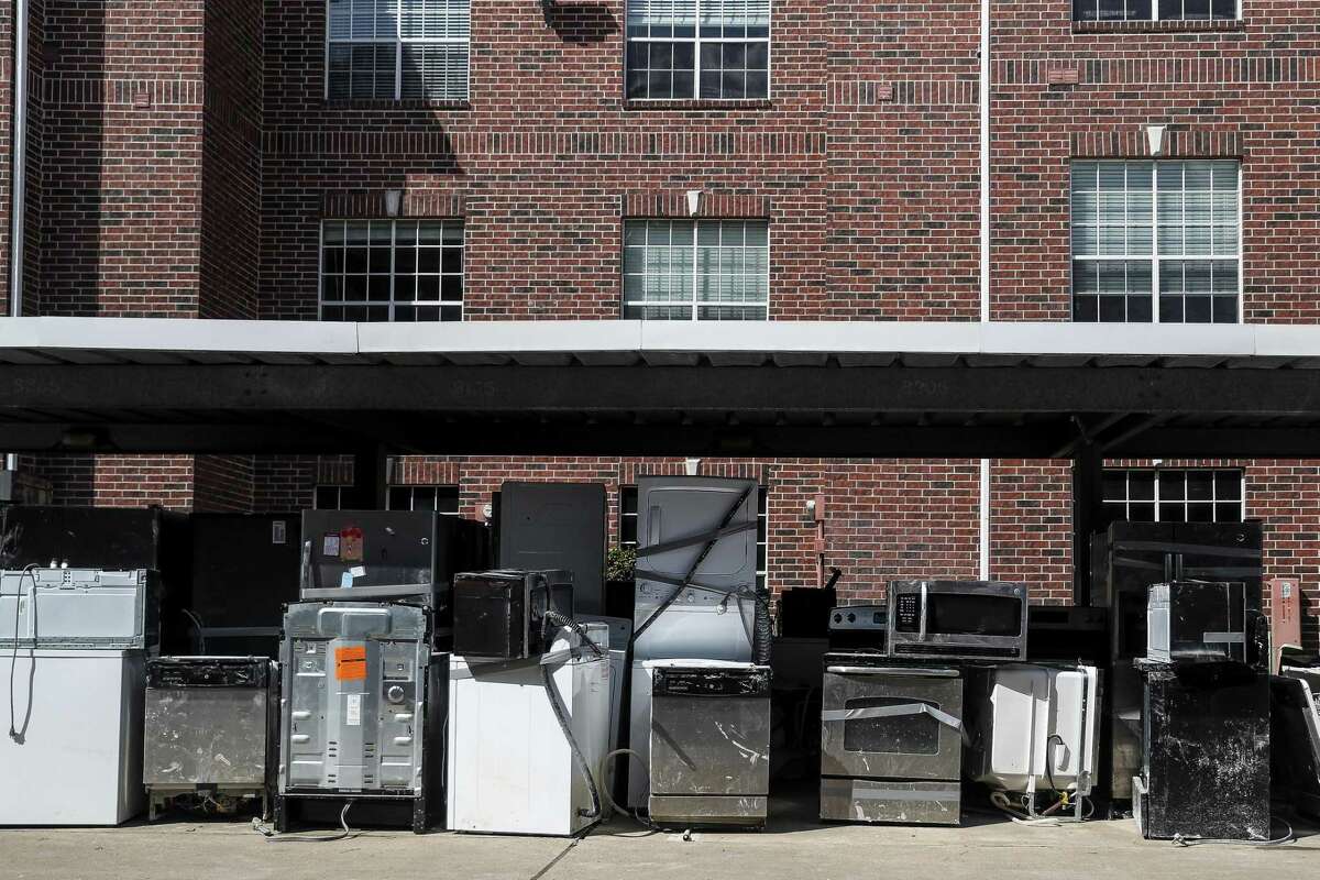 Appliances sit outside buildings at The Grand on Memorial which flooded during Hurricane Harvey Wednesday, Oct. 4, 2017 in Houston.