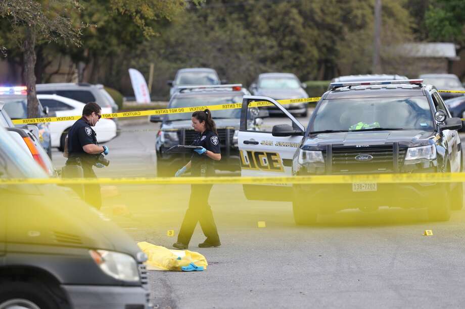 San Antonio Police investigate the scene of an officer involved shooting at the Huebner Commons shopping center at the corner of Huebner and Vance Jackson, Wednesday, March 20, 2019. According to SAPD Chief William McManus, a 23-year-old woman was acting erratically and was seen to be carrying a weapon, a police sargent responded and the woman pulled out an Uzi and was shot dead. Photo: Jerry Lara