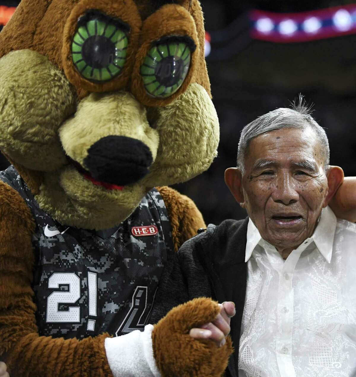 Liban Brillantes, 103, who was born in the Philippines and served in the Army’s 121st Infantry Division, is honored during a timeout of the Miami Heat at San Antonio Spurs NBA game in the AT&T Center on Wednesday, March 20, 2019. Brillantes was only 19 when he served as a messenger between the U.S. and Philippine governments during World War II. He witnessed an execution of prisoners by Japanese soldiers and found one prisoner alive. He carried him into the jungle and nursed him back to health.