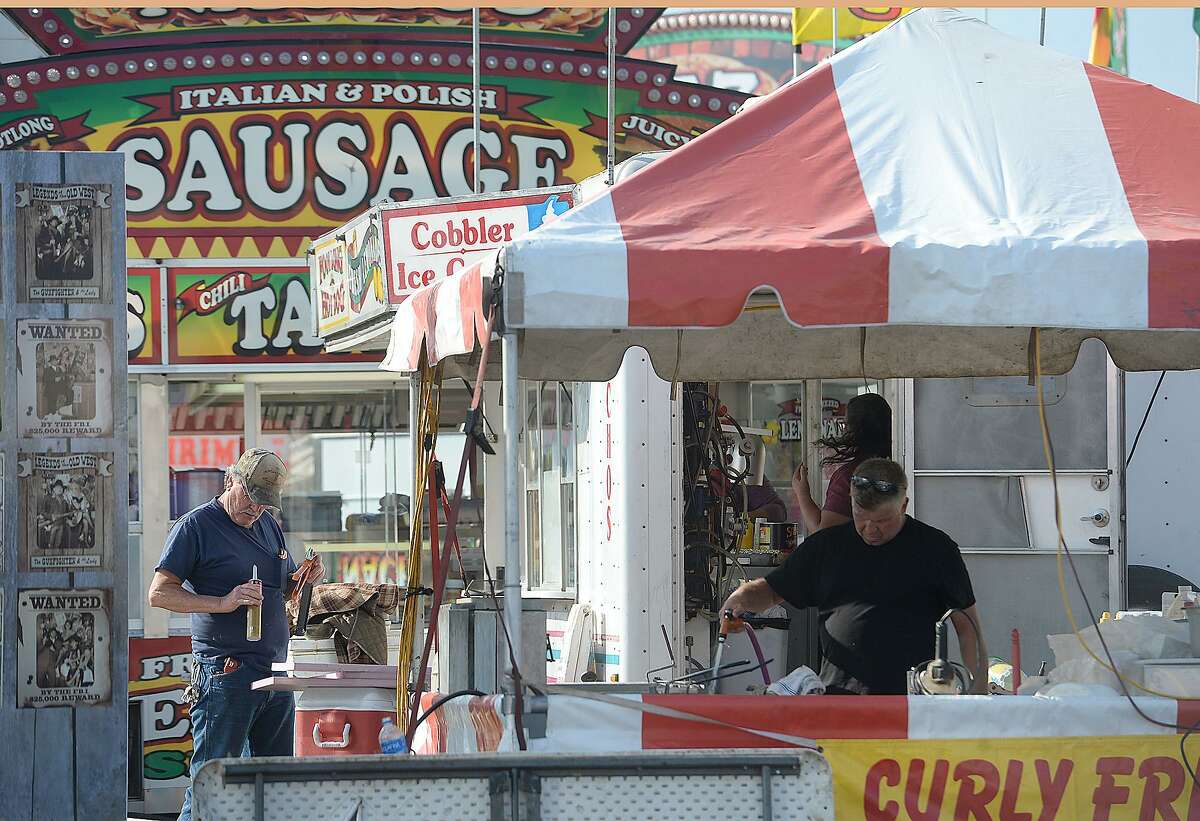 Food booth owners set up as workers continue to prepare for Thursday's opening of the YMBL South Texas State Fair at Ford Park. Photo taken Wednesday, March 20, 2019 Kim Brent/The Enterprise