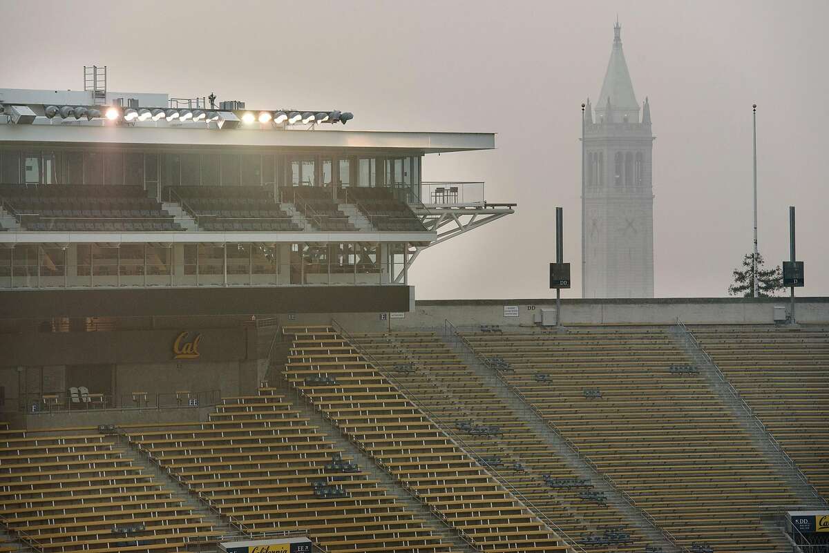 A smokey haze hangs over Memorial Stadium and Sather Tower after it was announced that the "Big Game" versus Stanford University over the weekend is canceled due to poor air quality, in Berkeley, California, on Friday, November 16, 2018.