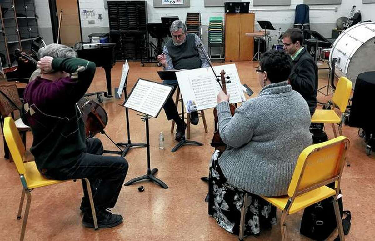 Jacksonville Symphony Orchestra conductor and music director Garrett Allman (center) leads a chamber ensemble rehearsal ahead of the orchestra’s “Embrace the Music” concert on Saturday. The concert will focus on chamber music designed for small groupings of instruments.
