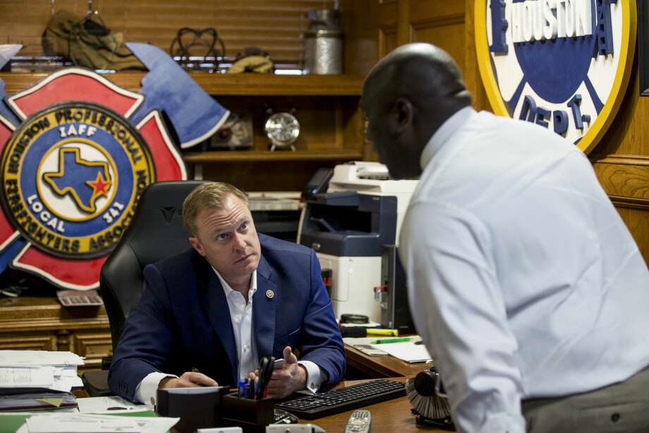 Marty Lancton, president of the Houston Professional Firefghters Association, talks to Roy Cormier as he works in his office the IAFF Local 341 union hall on Thursday, Feb. 7, 2019, in Houston. Lancton has been at the center of the fight with the city over pensions and pay. Photo: Brett Coomer/Staff Photographer