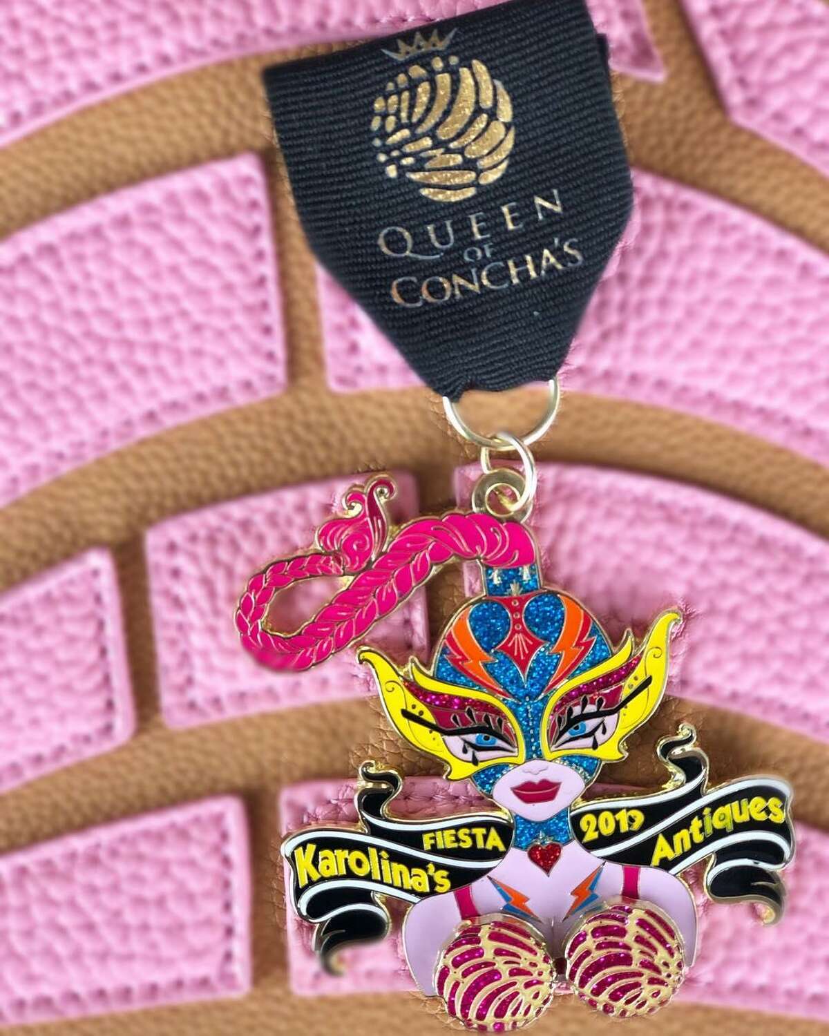 Karolina’s Antiques, 1705 Blanco Road, 210-731-9787, karolinasantiques.com Queen of Conchas Fiesta medal ($12): For Karolina’s 2019 Fiesta medal, the store’s family transformed its lady logo into a masked luchadora with a pair of spinning sweet breads that could only be called “bustiCONCHAS.”