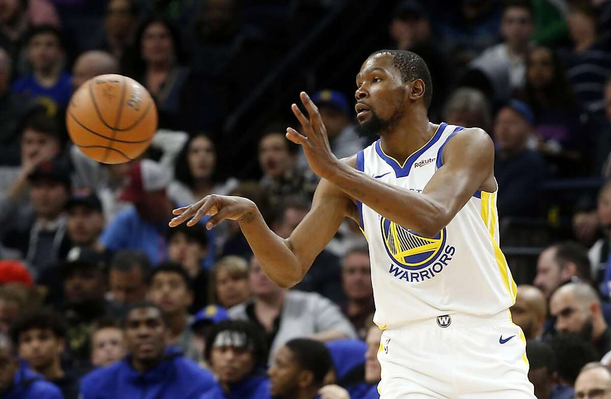 Golden State Warriors' Kevin Durant passes the ball in the first half of an NBA basketball game against the Minnesota Timberwolves Tuesday, March 19, 2019, in Minneapolis. (AP Photo/Jim Mone)
