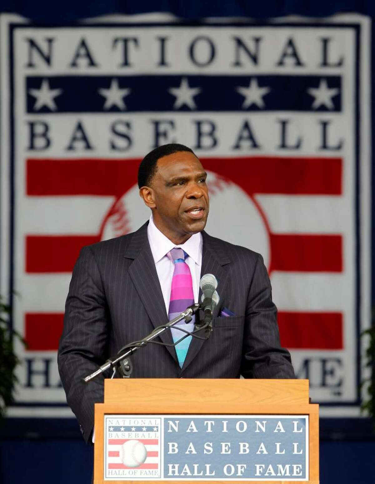 Andre Dawson delivers his Baseball Hall of Fame induction speech during a ceremony at the Clark Sports Center in Cooperstown, N.Y., on Sunday, July 25, 2010. (AP Photo/Mike Groll)