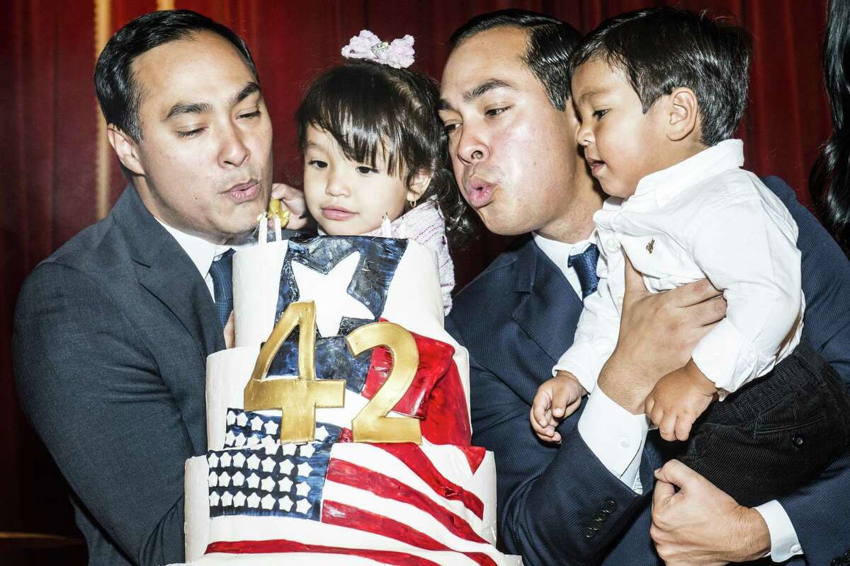 Brothers Joaquin, left, and Julian Castro, right blow out their birthday cake while holding their children, Andrea Elena Castro and Cristi‡n Juli‡n Castro, respectively during their birthday party on Friday, September 16, 2016 in San Antonio, Texas. Joaquin Castro is a Democratic U.S. Representative for Texas' 20th district and Julian Castro is the U.S. Secretary for Housing and Urban Development. The twin brothers celebrated their 42nd birthday.