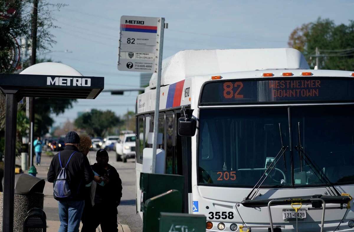 People wait to board a Metro Route 82 bus on Westheimer near Gessner Wednesday, Jan. 9, 2019, in Houston.