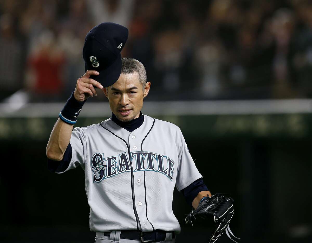 Seattle Mariners right fielder Ichiro Suzuki waves to spectators while leaving the field for defensive substitution in the eighth inning of Game 2 of the Major League baseball opening series against the Oakland Athletics at Tokyo Dome in Tokyo, Thursday, March 21, 2019. (AP Photo/Toru Takahashi)