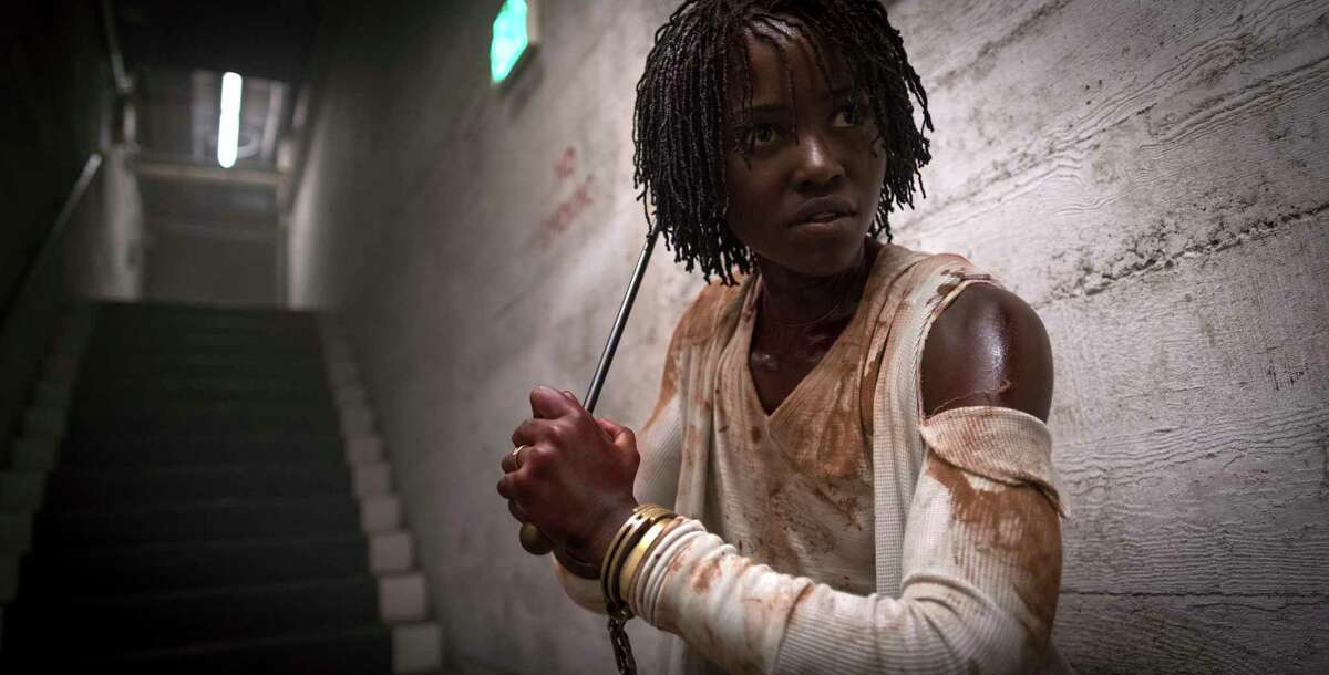 This image released by Universal Pictures shows Lupita Nyong'o in a scene from "Us," written, produced and directed by Jordan Peele. The film, based in Santa Cruz, has scared some of the people who have seen it away from the California beach town. Check out their reactions to the film, and what it means for their relationship with Santa Cruz, in the following tweets. >>>