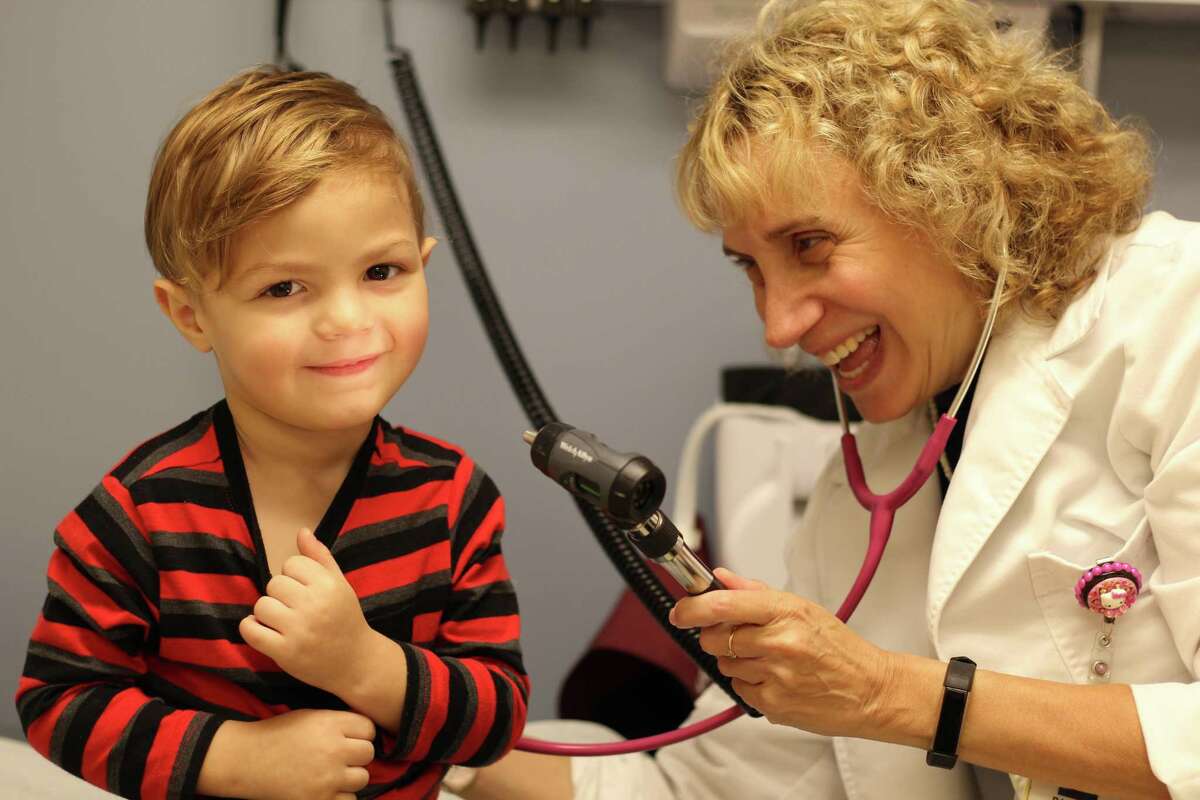 Marc Maldonado, 2, from Fair Haven Heights, is examined by Dr. Pamela Kwittken, the pulmonary specialist at the asthma clinic at Fair Haven Community Health Center.