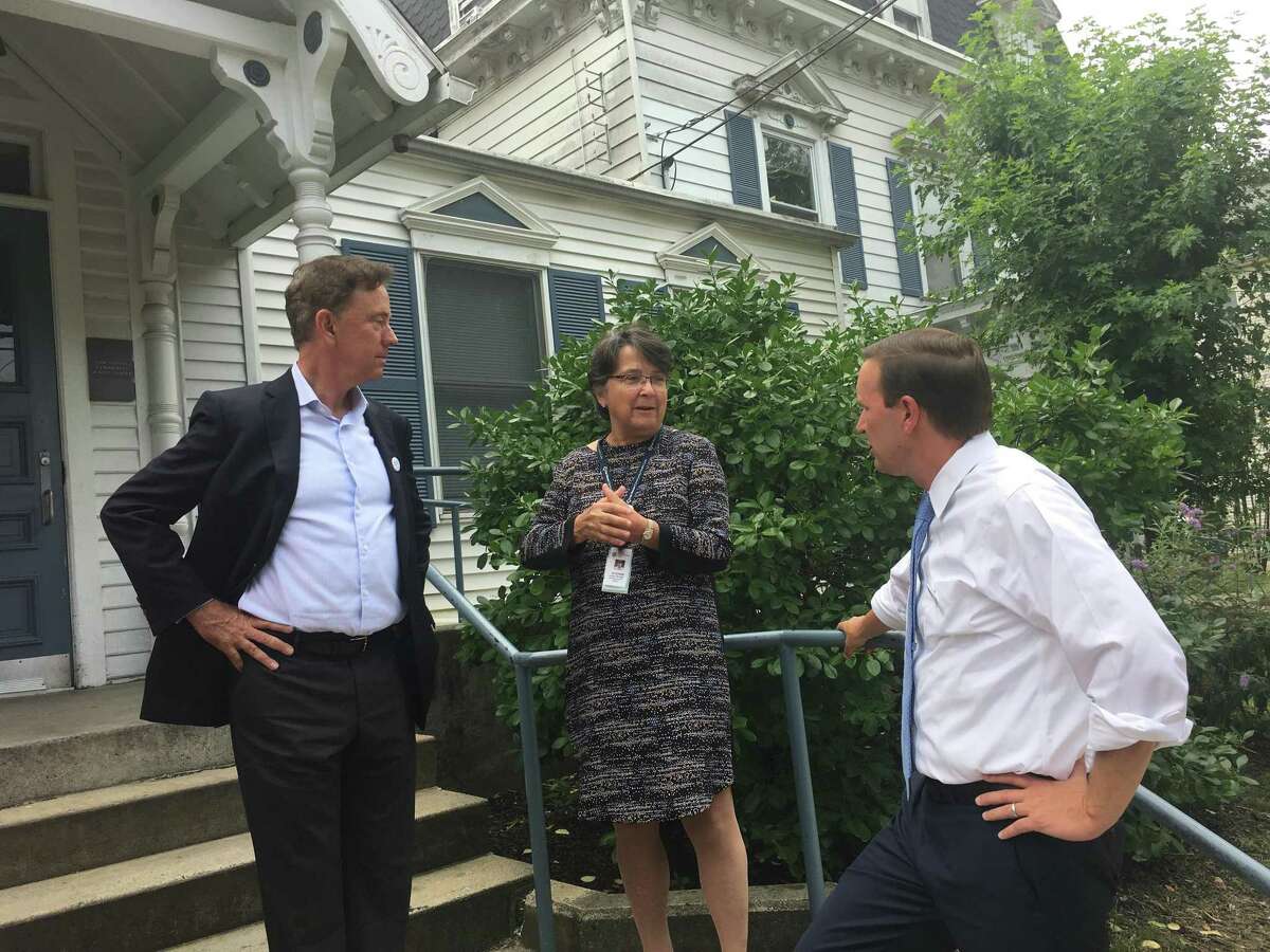 U.S. Sen. Chris Murphy, D-Conn., and then-Democratic gubernatorial candidate Ned Lamont, meet with Suzanne Lagarde, CEO of the Fair Haven Community Health Center.