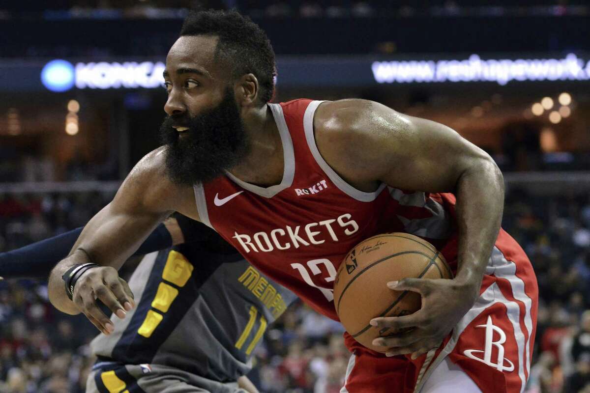 Houston Rockets guard James Harden (13) handles the ball in the second half of an NBA basketball game against the Memphis Grizzlies Wednesday, March 20, 2019, in Memphis, Tenn. (AP Photo/Brandon Dill)