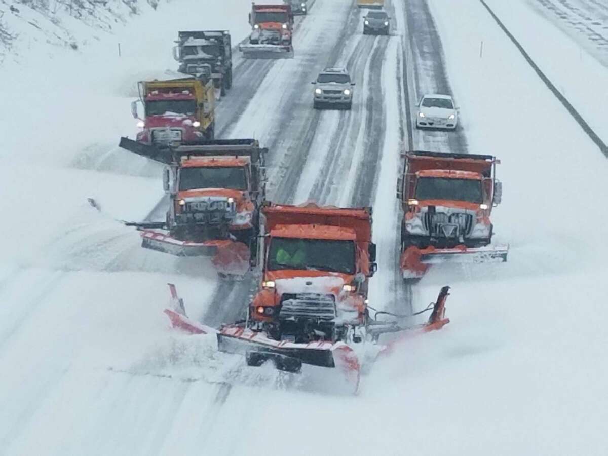 A combination of Connecticut Department of Transportation snow plows and contractors the state hires to keep the road clear every winter at work during a recent storm. DOT officials say it is becoming harder to find contractors to keep state roads and highways clear.