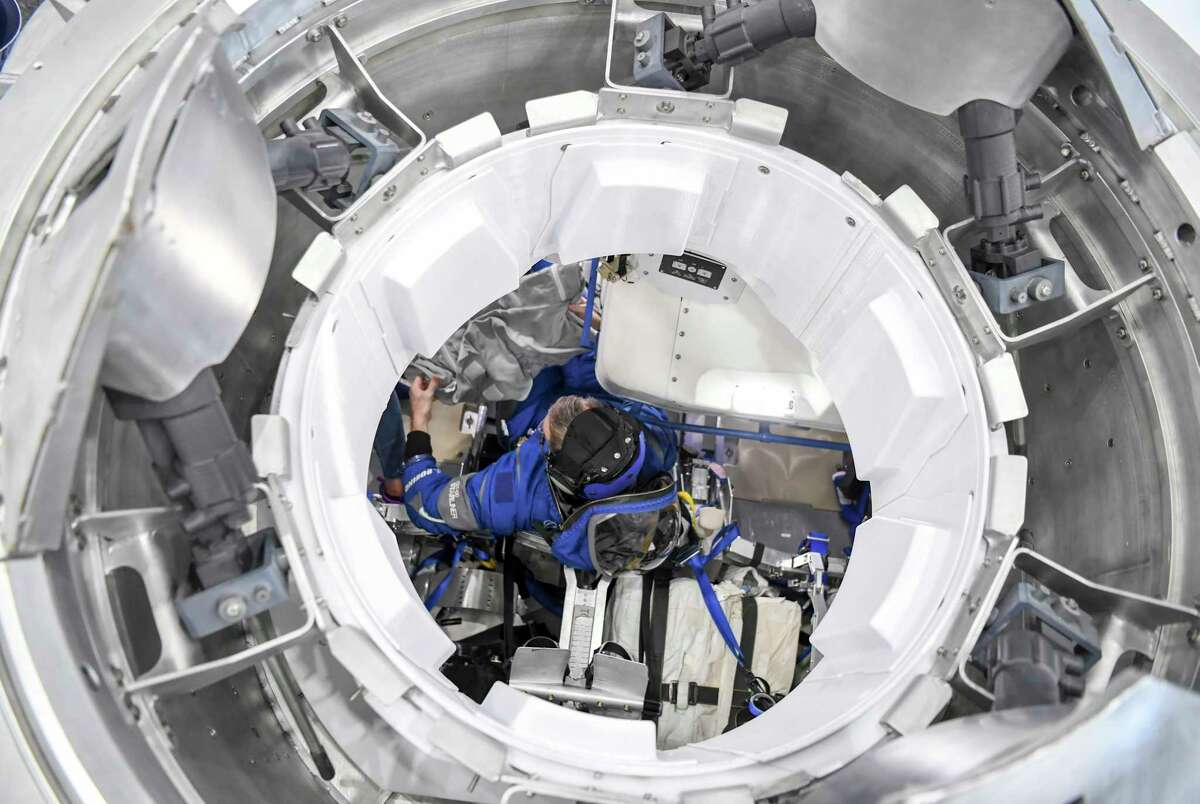 Astronaut Chris Ferguson trains in the Boeing Starliner mock-up at NASAs Johnson Space Center in Houston.