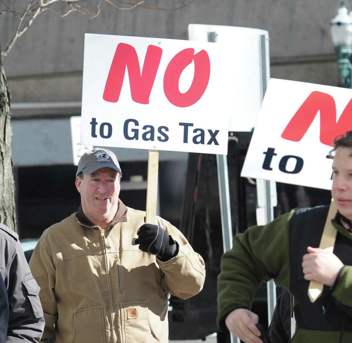 Public protests against tolls are held in front of the Stamford Goverment Center last year.