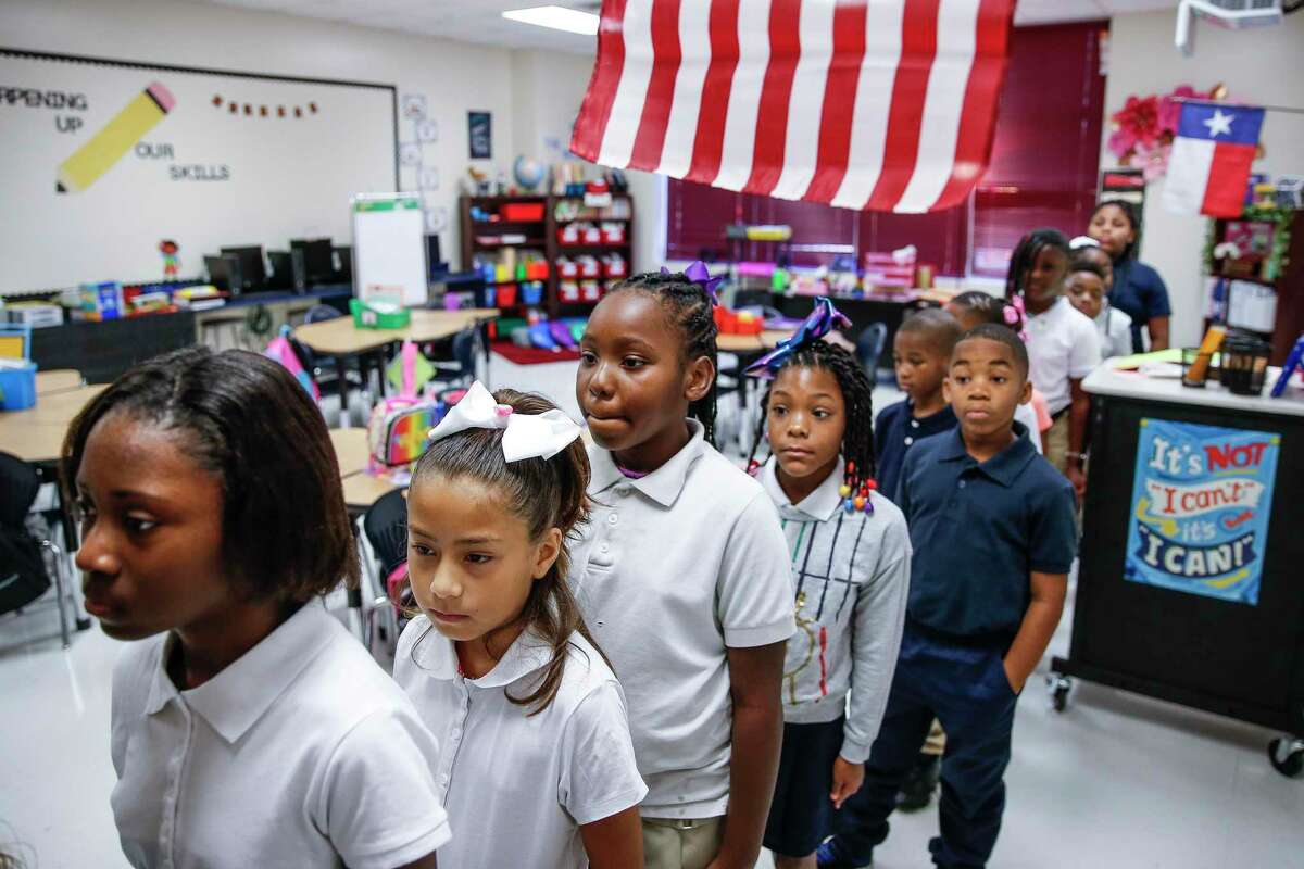 Hilliard Elementary School third grade students line up in their classroom during the first day of school as students return to the school for the first time since Hurricane Harvey Monday Aug. 27, 2018 in Houston. The school underwent $5 million in repairs after the hurricane filled the school with more than four feet of water.