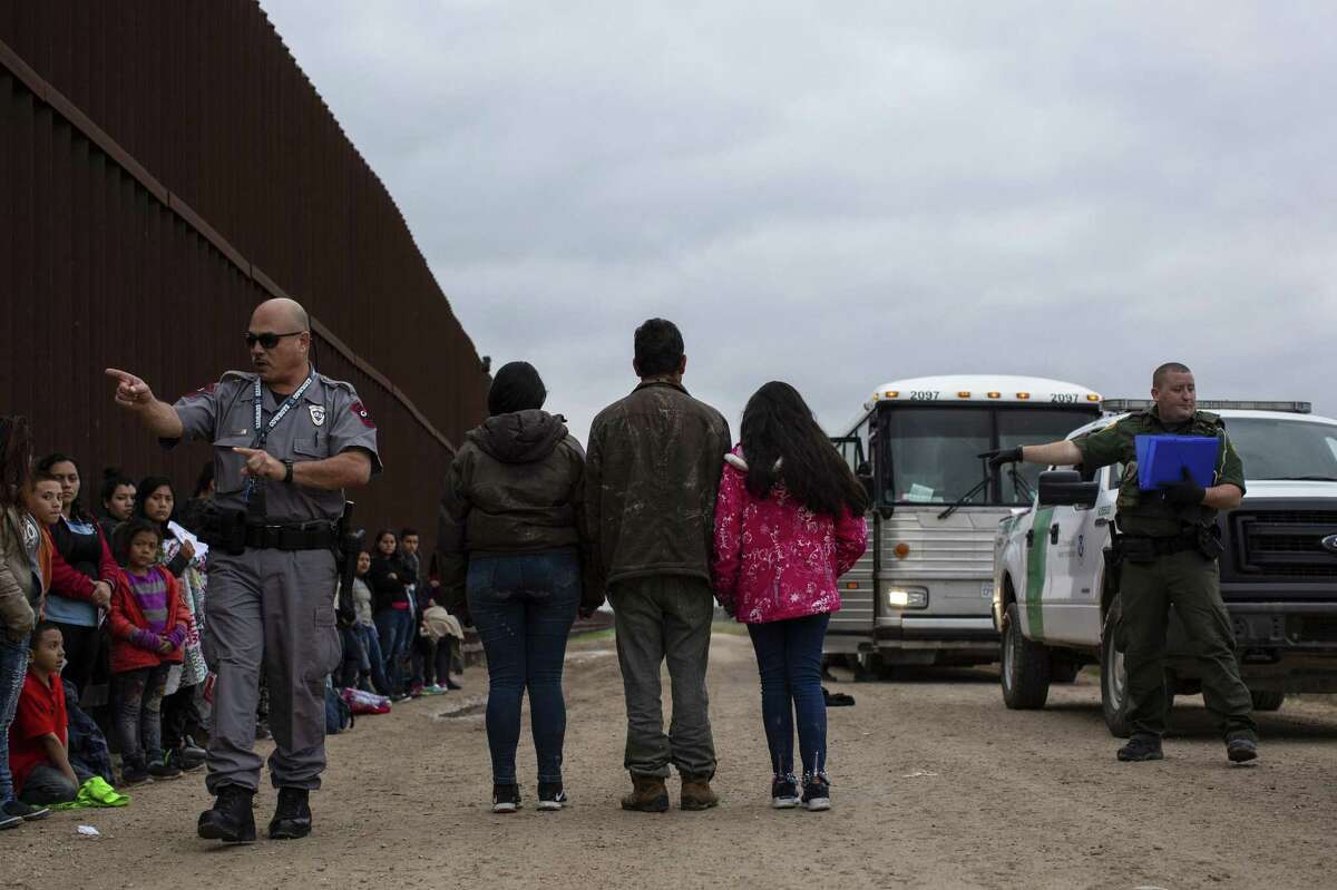 Migrants from Central America turn themselves in to Border Patrol agents in Penitas. More than 76,000 migrants crossed the border in February. A reader asks how that could not be considered a crisis.