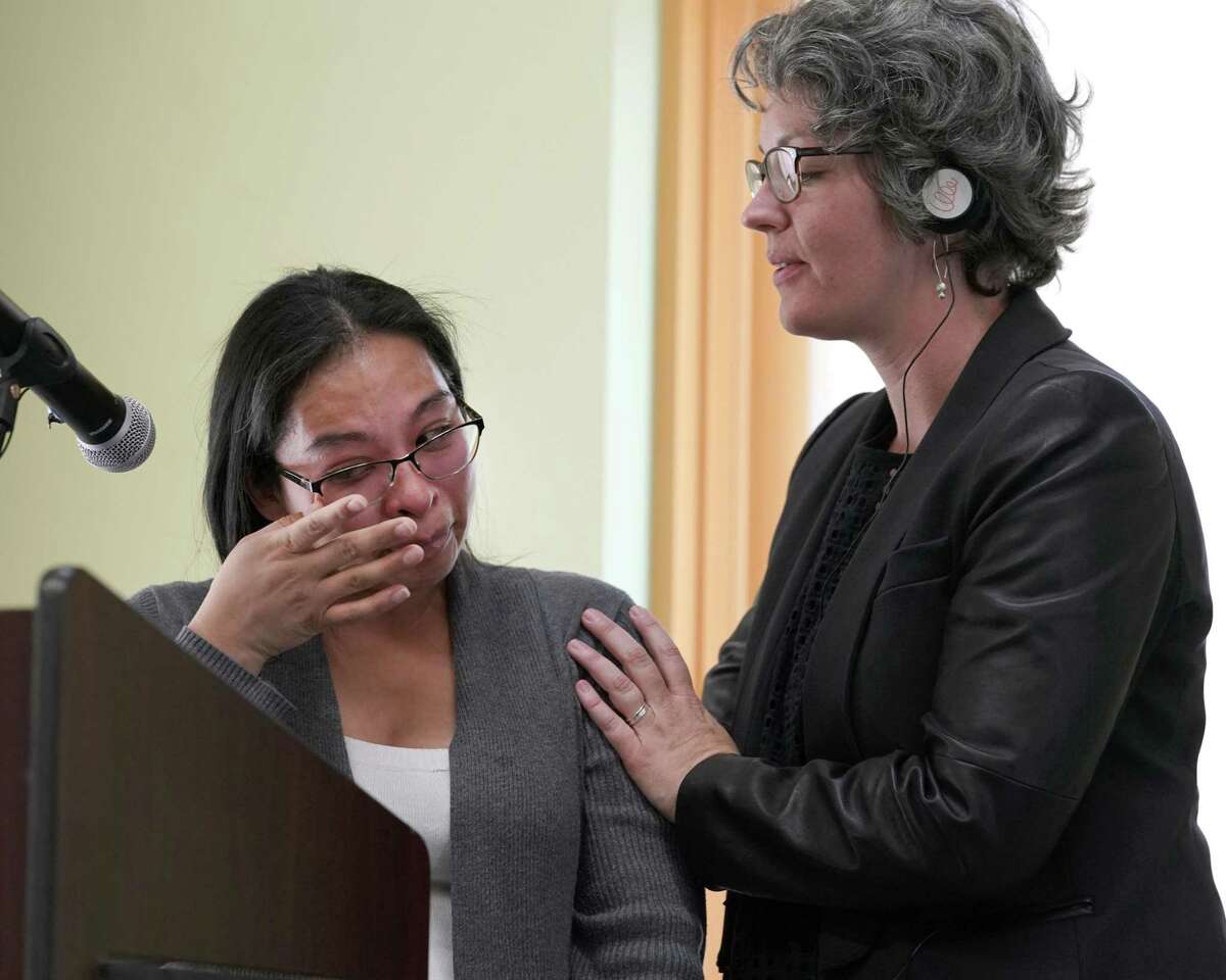 Emeralda Velasquez, left, is comforted by Kate Vickey, excutive director of Houston Immigration Legal Services Collaborative, as she began to cry while speaking about Harvey's impact on her family during the presentation of the Humanitarian Action Plan by the Houston Immigration Legal Services Collaborative held at BakerRipley, 6500 Rookin St., Friday, March 22, 2019, in Houston.