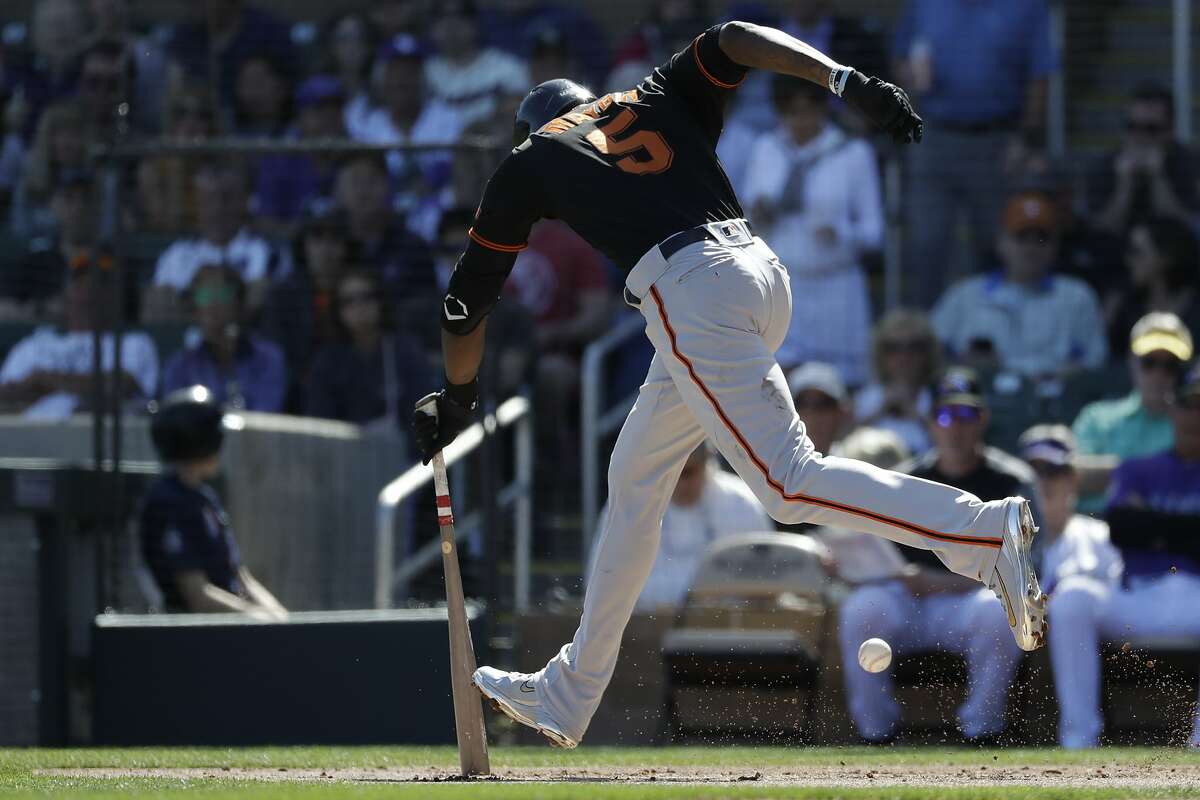 San Francisco Giants' Cameron Maybin runs into his bunt for an out against the Colorado Rockies during the second inning of a spring baseball game in Scottsdale, Ariz., Sunday, March 3, 2019. (AP Photo/Chris Carlson)