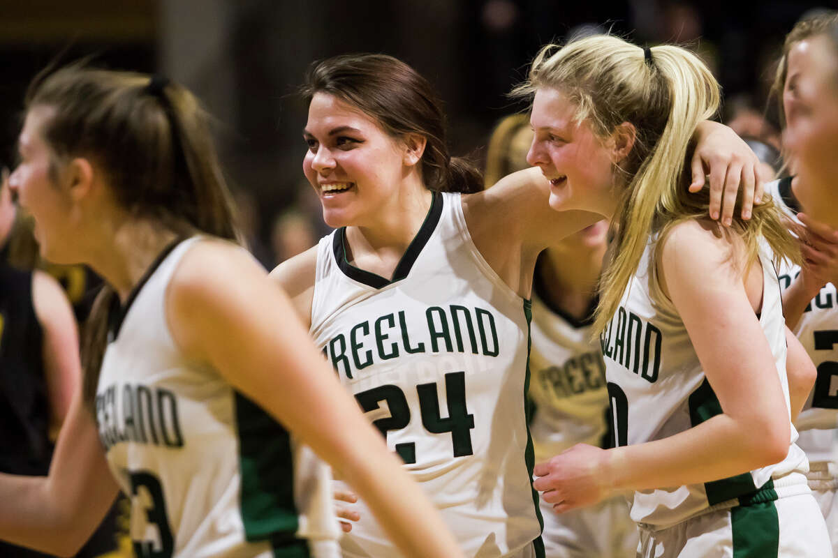 Freeland players celebrate after their 71-66 state semifinals victory over Hamilton on Friday, March 22, 2019 at Van Noord Arena in Grand Rapids. (Katy Kildee/kkildee@mdn.net)