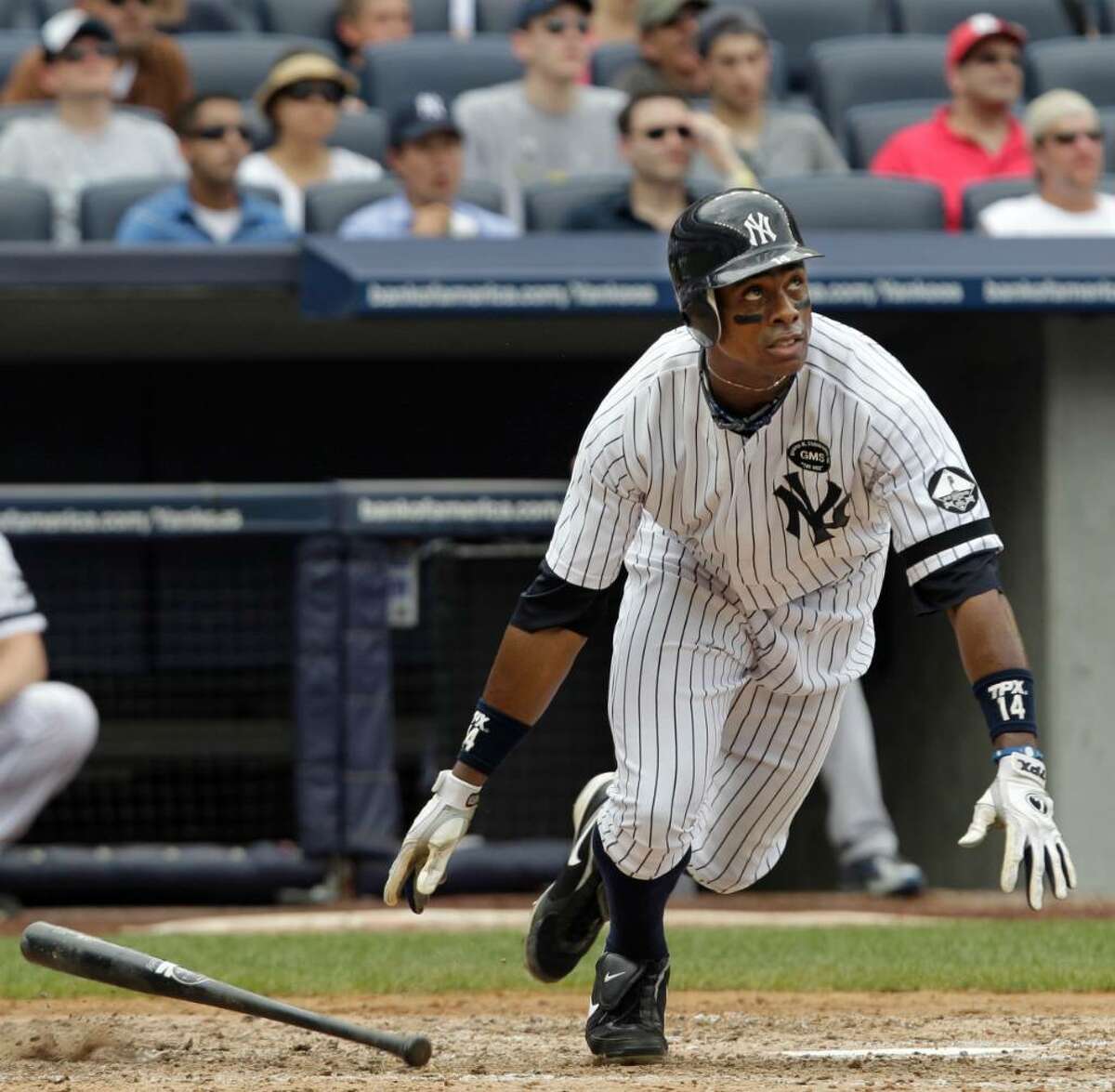 New York Yankees' Curtis Granderson watches his fourth-inning solo home run off Kansas City Royals starting pitcher Sean O' Sullivan in a baseball game at Yankee Stadium on Sunday, July 25, 2010, in New York. (AP Photo/Kathy Willens)