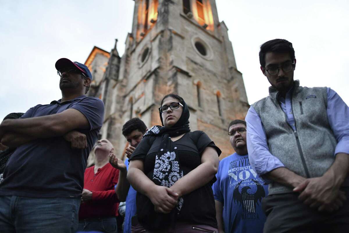 People of many faiths gather and pray in Main Plaza on Saturday for the victims of the mosque attacks in New Zealand a week ago.
