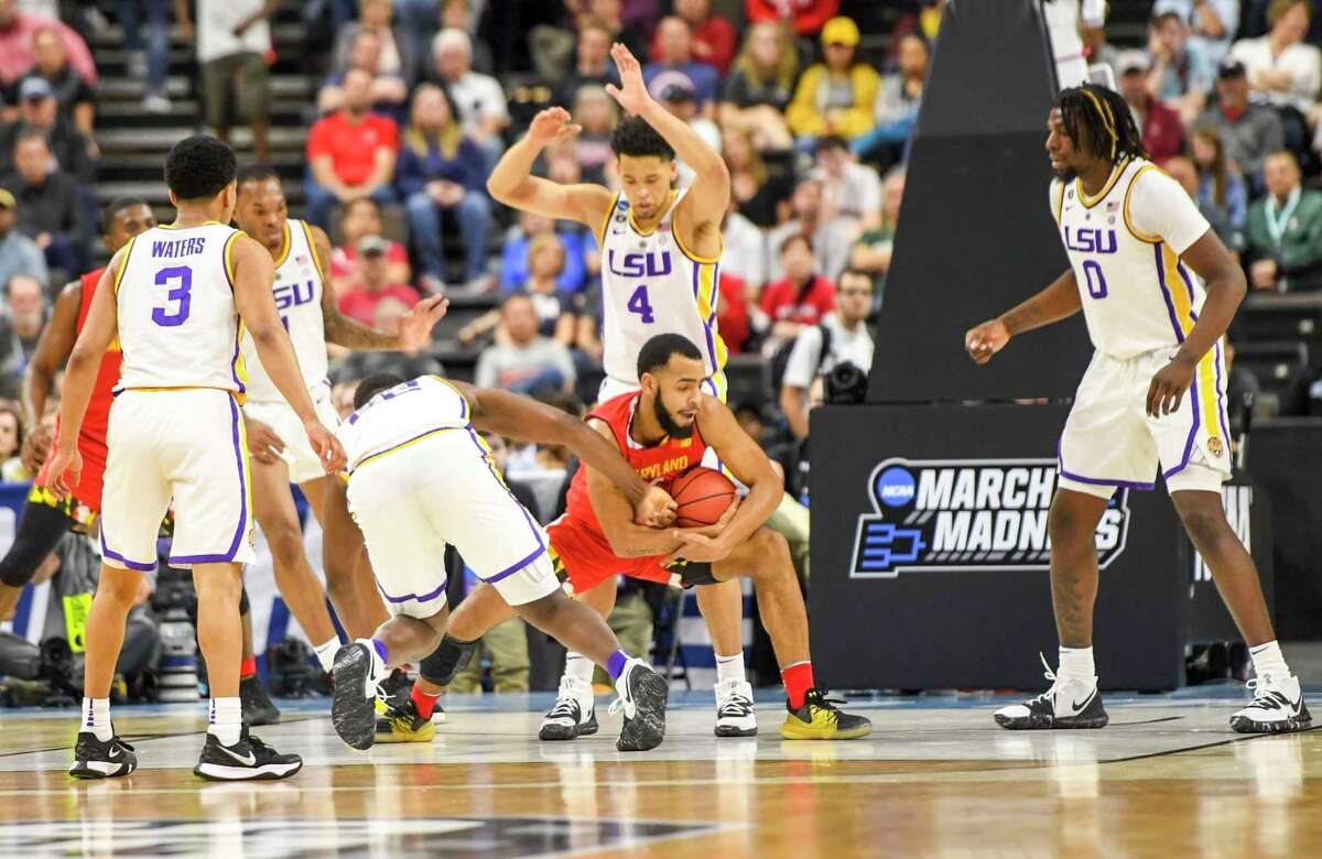 Maryland guard Eric Ayala (5) is surrounded by five LSU defenders during second round action of the NCAA Tournament on March 23 in Jacksonville, Florida.