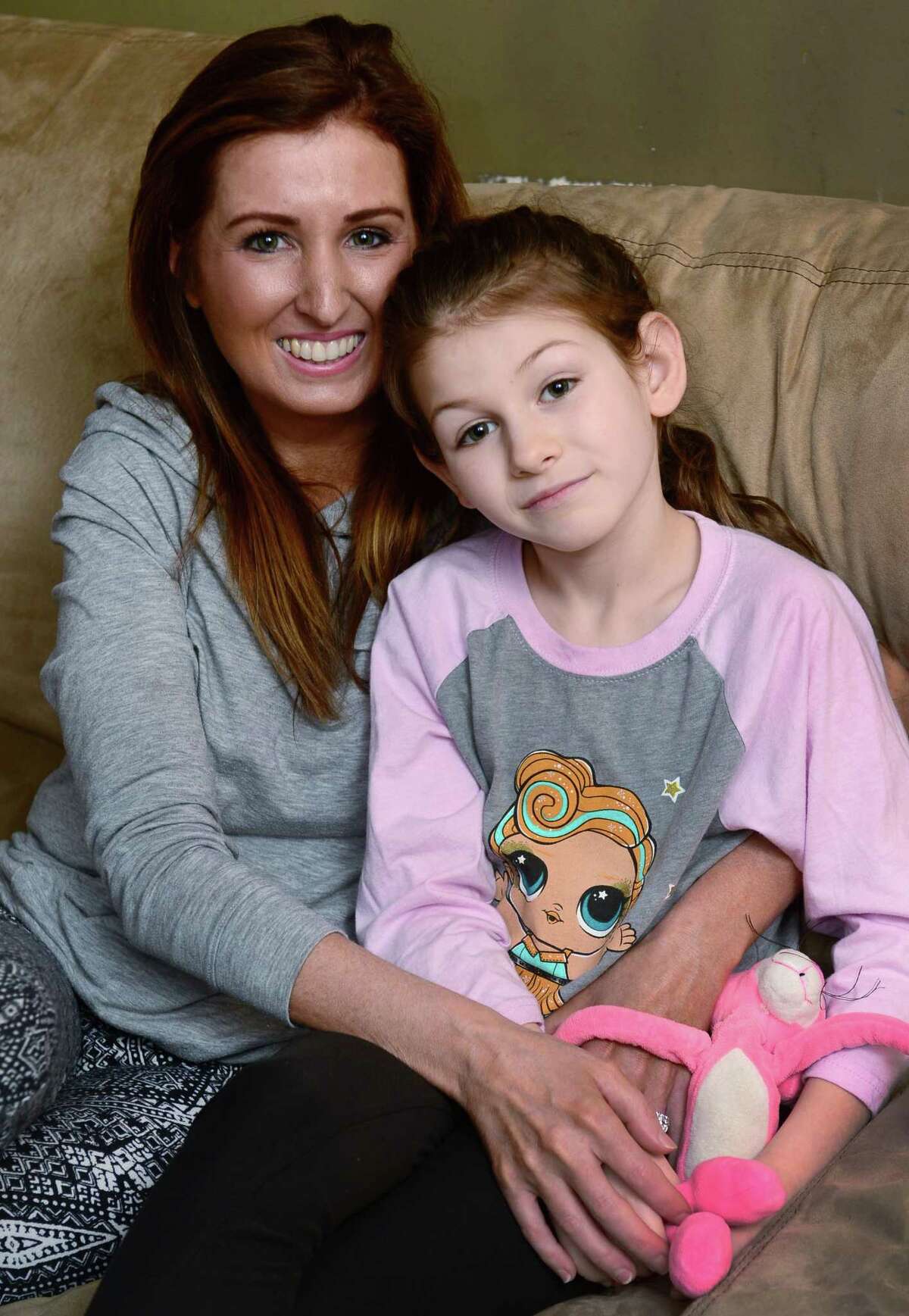 Erica DePalma, board member of the AG Bell Association for the Deaf and Hard of Hearing, with her hearing impaired daughter, Jameson DePalma, 7, at their home in Norwalk, Conn. DePalma is organizing an event for parents of children with hearing loss and their friends and families April 17, 2019. The event, also open to professionals who treat children with hearing impairments, provides a networking opportunity for parents looking to share tips and find resources -- and offers children living with disabilities the opportunity to forge friendships with each other. Childhood hearing loss is rare and some parents said they struggle to connect with families similar to theirs living in Fairfield County.