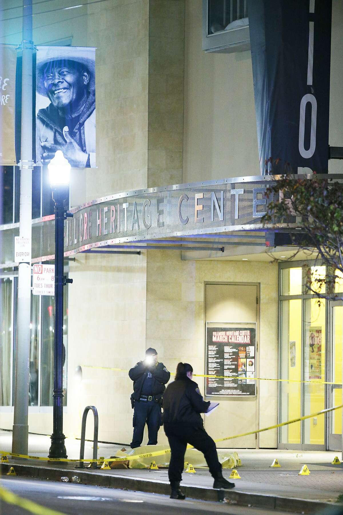 A body bag at the scene of a shooting outside the Fillmore Heritage Center as police investigate the area on Saturday, March 23, 2019, in San Francisco, Calif. Police said one is dead and several injured after a shooting.