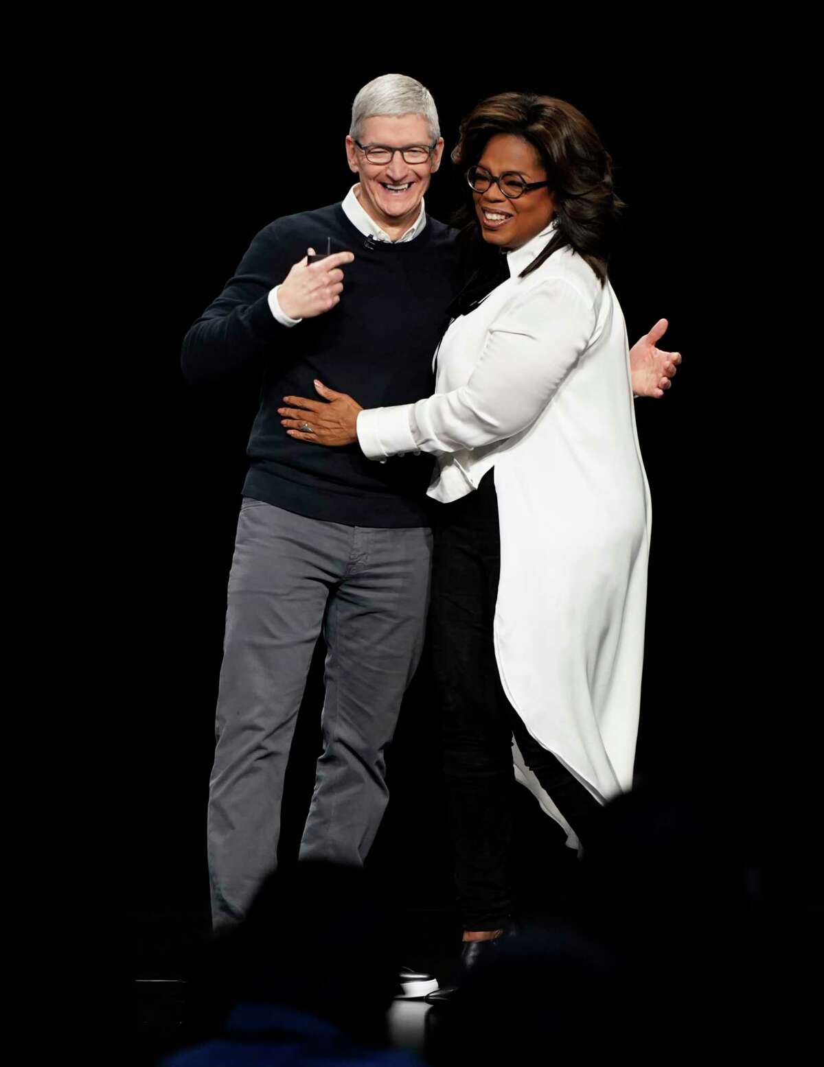 Apple CEO Tim Cook and Oprah Winfrey at the Steve Jobs Theater during an event to announce new products Monday, March 25, 2019, in Cupertino, Calif.