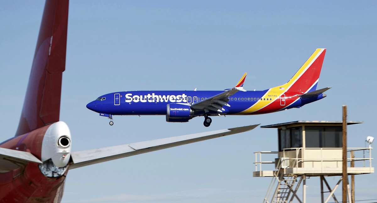 In this Saturday, March 23, 2019 photo, a Southwest Airlines Boeing 737 Max aircraft lands at the Southern California Logistics Airport in the high desert town of Victorville, Calif. Southwest, which has 34 Max aircraft, is making cancellations five days in advance, with an average of 130 daily cancellations. (AP Photo/Matt Hartman)