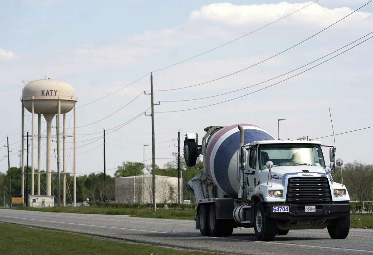 A concrete truck travels along U.S. 90 on March 20 near Katy’s water tower.