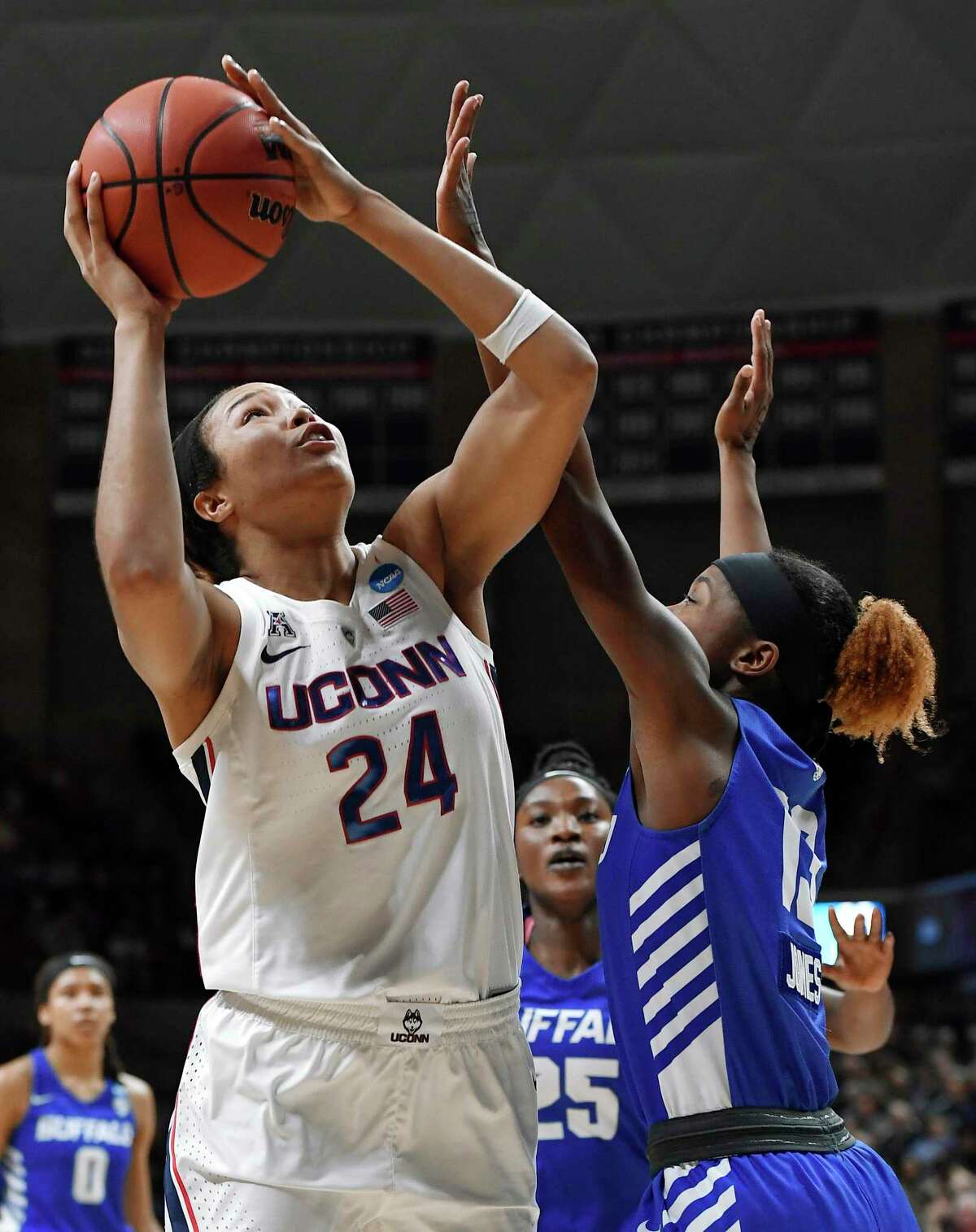 UConn’s Napheesa Collier, left, shoots over Buffalo’s Autumn Jones during an NCAA Tournament second-round game on March 24.