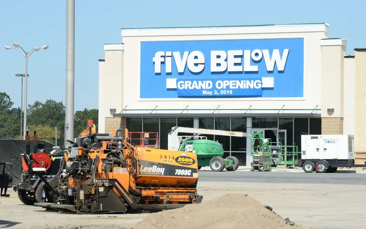 Work continues Friday on the outside of Parkdale Mall where several new stores in eluding Dick's Sporting Goods and Five Below are expected to open soon. A sign indicates Five Below will be opening on May 3. Photo taken Friday, 3/22/19