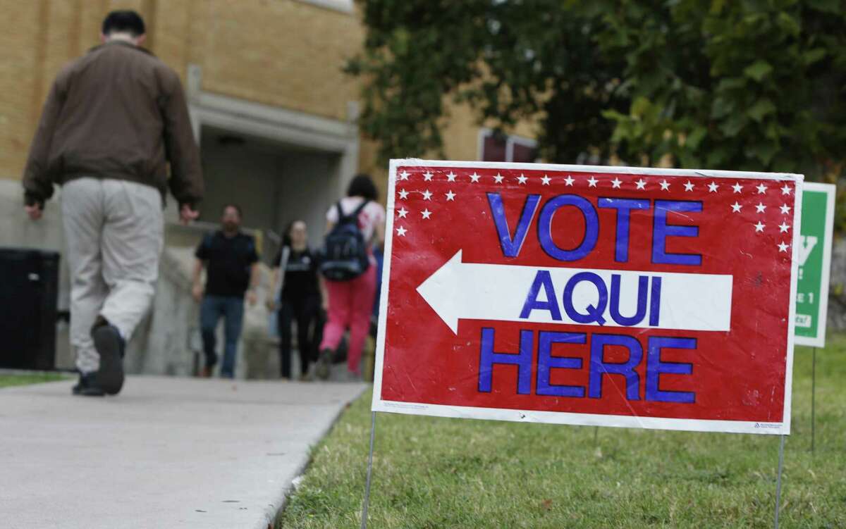 A sign shows the way to the polling station at Austin Community College on November 4, 2014 in Austin, Texas. Voters headed to the polls today to decide a number of tight races. (Photo by Erich Schlegel/Getty Images)